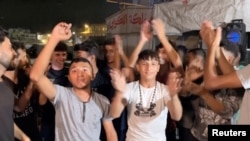 Палестинцы в Хан-Юнисе на юге сектора Газа празднуют достижение соглашения о перемирии. 9 октября 2025 года