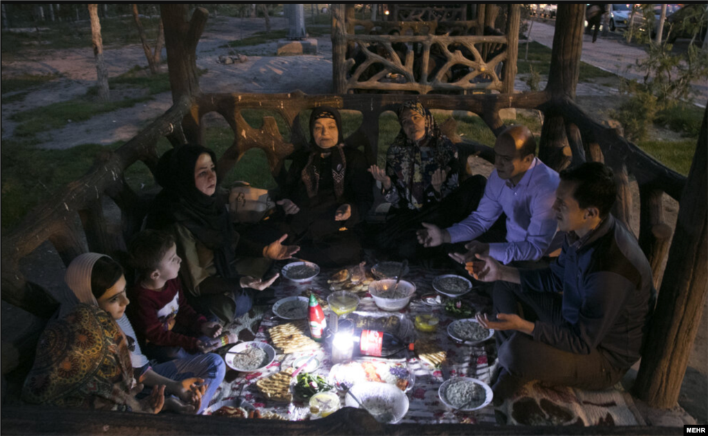A family in the Iranian capital, Tehran, break their daily Ramadan fast. Throughout the holy month Muslims are not permitted to eat or drink during the day. The Ramadan fast is intended to bring the faithful closer to God and to remind them of the suffering of those less fortunate.