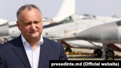 Moldovan President Igor Dodon accused his country's pro-Western government of trying to "add the Moldovan Army to the NATO side" and involve it in "geopolitical confrontations."