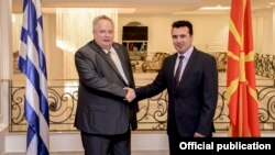 Macedonia Prime Minister Zoran Zaev (right) with Greek Foreign Minister Nikos Kodzias in August