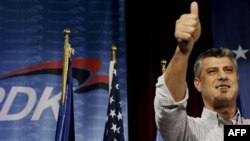 Kosovo Prime Minister Hashim Thaci gives a thumbs up as he claims victory for his Democratic Party of Kosovo (PDK) in Pristina late on November 15.