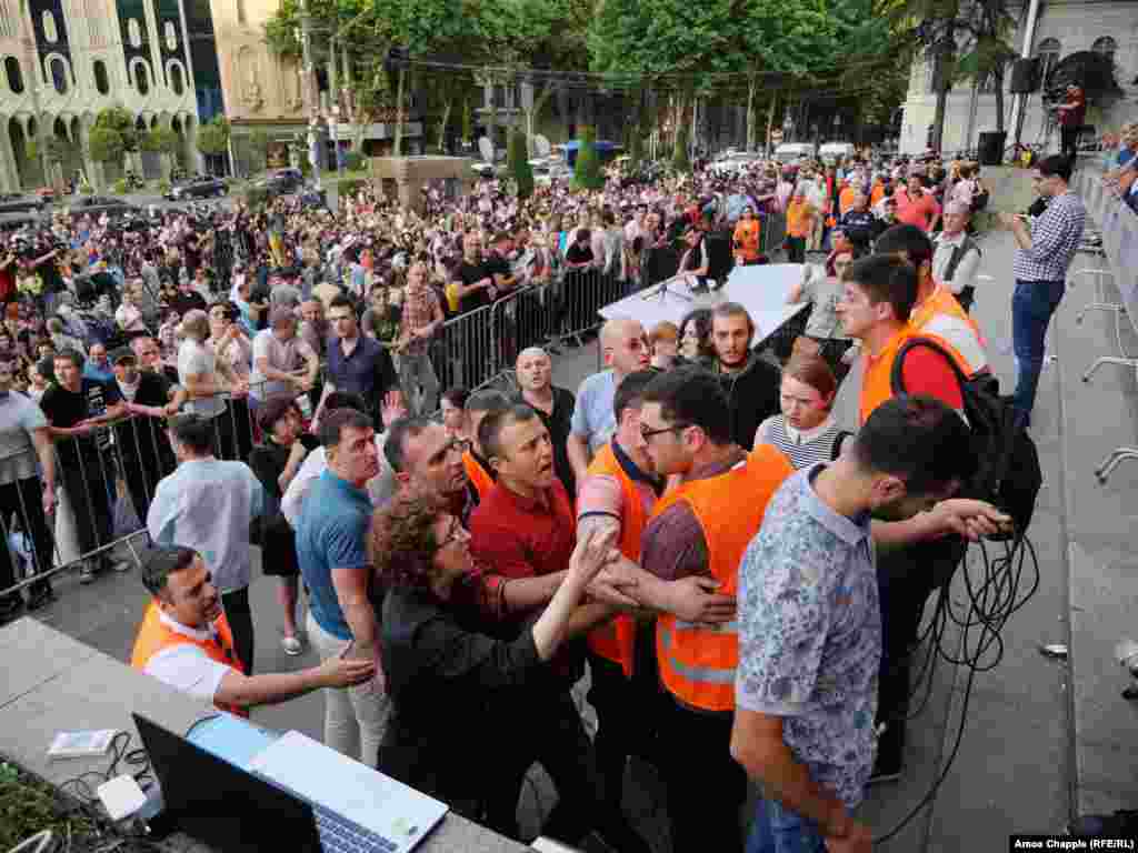 Arguments broke out while opposition politicians apparently tried to gain access the stage and address the protesters. The appearance by Gavrilov in parliament on June 20 drew strong reactions from opposition members, student activists, and others as thousands turned out to demonstrate. Georgia's parliamentary speaker, Irakli Kobakhidze, resigned after the incident.