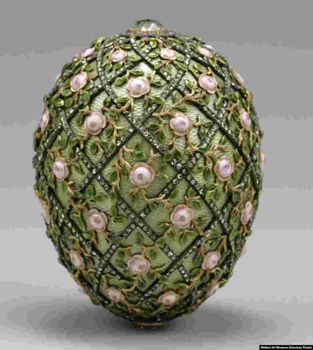 The 7.7-centimeter-tall Rose Trellis Egg, created in 1907 from gold, enamel, and strings of tiny diamonds. As Faberge oversaw the creation of this egg, Russia was reeling from a disastrous war with Japan and the events known as "Bloody Sunday," in which scores of peaceful protesters were shot dead in front of the tsar's Winter Palace.    