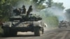 UKRAINE – Ukrainian troop move by tanks on a road of the eastern Ukrainian region of Donbas on June 21, 2022