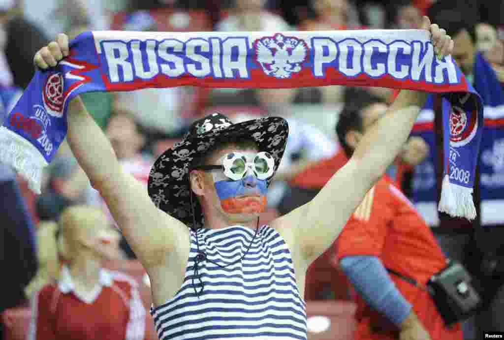 Russia's soccer fan cheers during the match against Poland in Warsaw.