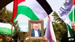پرتره اسماعیل هنیه و پرچمهای فلسطین در دانشگاه تهران