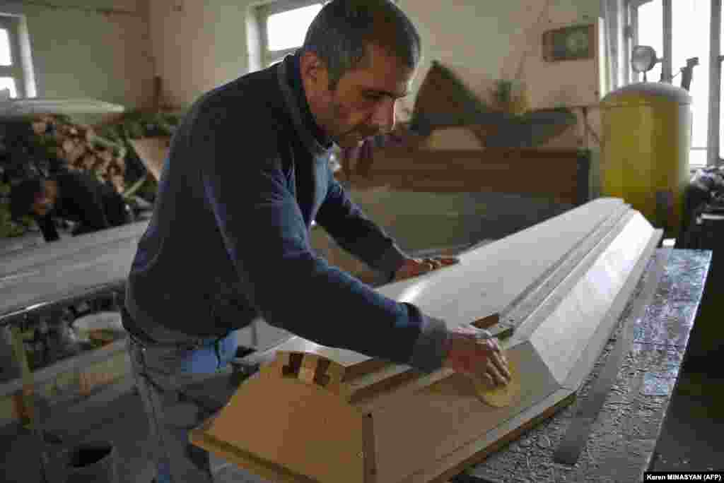 A man makes a coffin at a furniture workshop in Stepanakert on November 4. The company switched its business to casket production amid the ongoing military conflict between Armenia and Azerbaijan in Nagorno-Karabakh. 