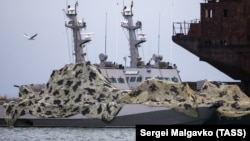 Ukrainian naval ships, which were seized by Russian authorities in November, are seen anchored in a port in Kerch, Crimea late last year.