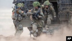 Militari germani la manevre în Lituania, în mai 2024.