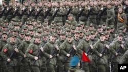 Russian troops march during a rehearsal for a Victory Day military parade ahead of May 9 in St. Petersburg on April 22.