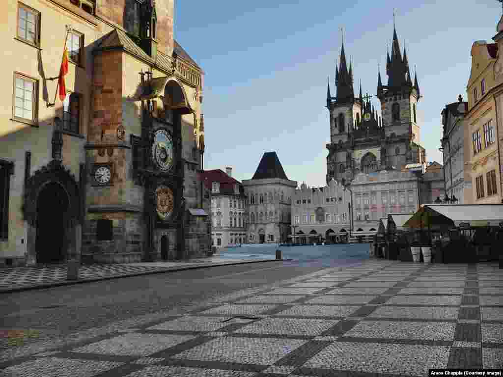 One of Prague's most famous sites, Old Town Square, stands nearly empty. This space is usually thronged with thousands of tourists. 