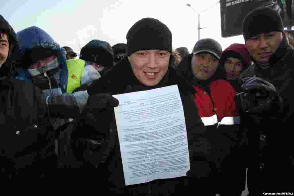 Protesters in Aktau present a list of their demands. 