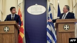 Nikos Kotzias (right) with Macedonian Foreign Minister Nikola Dimitrov in Athens in June.