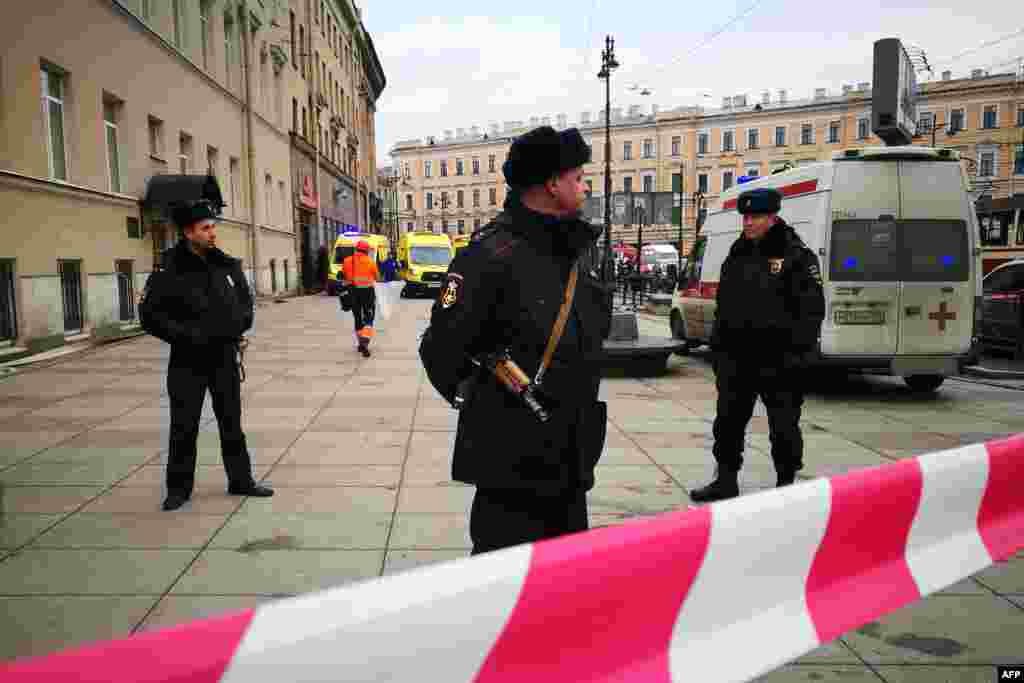 Police officers block an entrance to the Tekhnologichesky Institut subway station. 