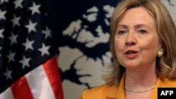 US Secretary of State Hillary Clinton speaks to an Iranian delegation in Bahrain.