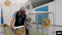 A member of a local election committee prepares a ballot box in this file photo.