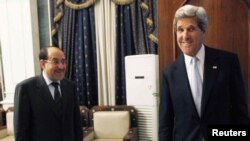 Iraqi Prime Minister Nouri al-Maliki (left) and US Secretary of State John Kerry meet in Baghdad on March 24.