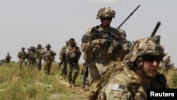 U.S. soldiers patrol with Afghan National Army soldiers in Kandahar Province, a connection Tehran would like to see end.