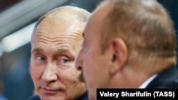 Президент Росії Володимир Путін та президент Азербайджану Ільгам Алієв беруть участь у 32-му чемпіонаті світу з дзюдо на Національній арені гімнастики в Баку, Азербайджан, 27 вересня 2018 року