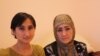 Gulnoza and her mother, Azadajon, work together selling perfumes at a stand at the bazaar in Osh.
