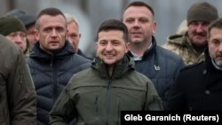 Ukrainian President Volodymyr Zelenskiy visits a section of a restored bridge, which was damaged during the military conflict between Ukrainian government forces and Russian-backed separatists, in the frontline town of Stanytsya Luhanska, on November 20.