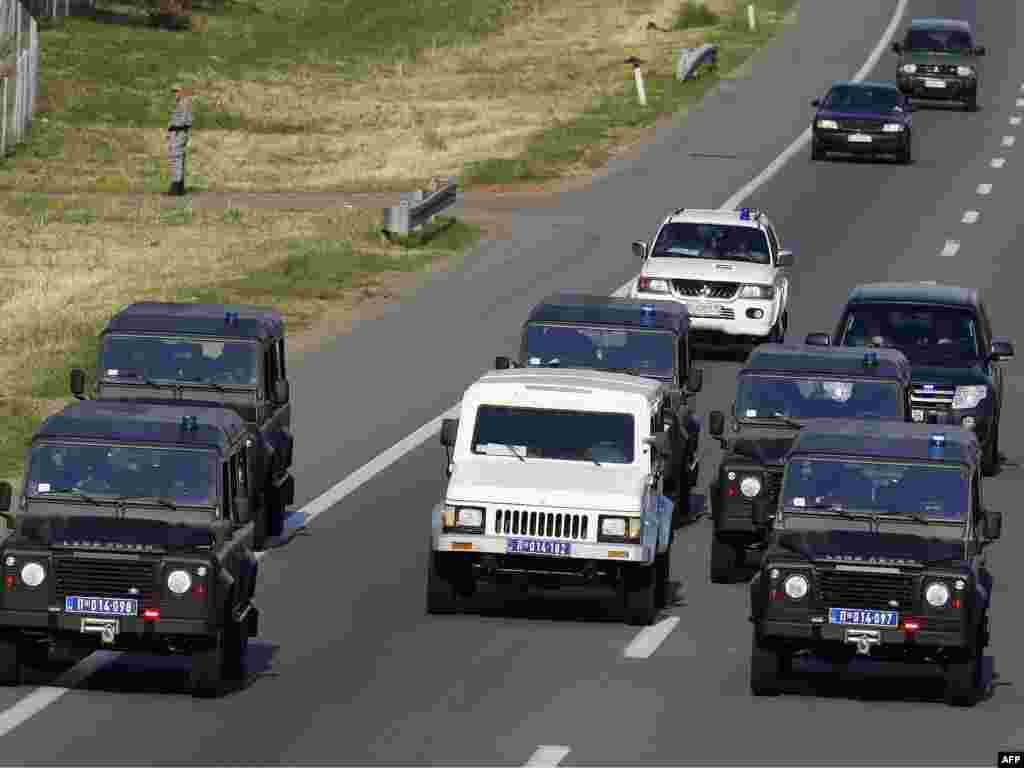 The convoy allegedly carrying Mladic to the airport in Belgrade. He was thought to be inside the white, heavily fortified vehicle. AFP photo by Marko Djokovic