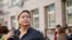 Russia -- Olga Romanova, the director of Rus Sidyashchaya (Russia Behind Bars), stands outside a Moscow court, August 18, 2014