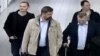 A photo released by the Dutch government purportedly showing four suspected Russian spies who traveled to the Netherlands on diplomatic passports earlier this year.