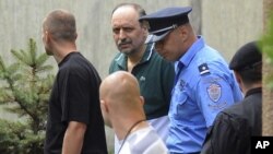 Following the arrest of Ratko Mladic, Goran Hadzic (centre) is the second high-profile war crimes suspect to be extradited from Serbia in less than a month.