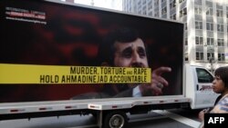 A truck displaying posters protesting against Iranian President Mahmud Ahmadinejad near the UN building in New York in September 2009
