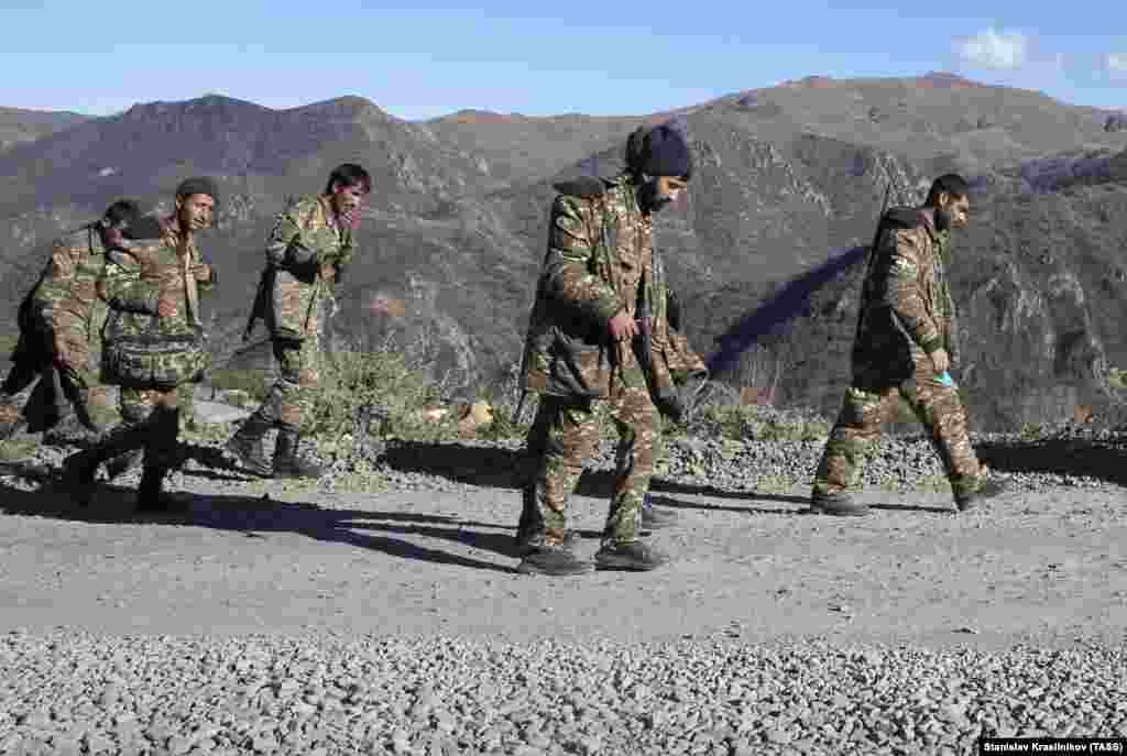 Armenian servicemen in Nagorno-Karabakh walk near the Armenian border on November 8. 
