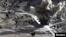 U.S. soldiers blow up a roadside bomb set up by Taliban fighters near the town of Walli Was in Paktika Province last month.