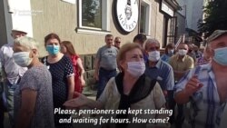 Moldovans Line Up For Vaccine Shot As Ex-President Walks By Moldovans Line Up For Vaccine Shot As Ex-President Walks By