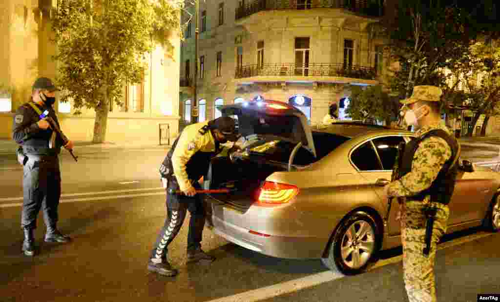 Police check a car in Baku shortly after the conflict broke out. Both Armenia and Azerbaijan announced martial law when the war in Nagorno-Karabakh began. 