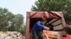 People drop off aid for victims of the Russian wildfires at a collection point in Moscow.