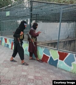 Young Taliban fighters with their weapons at Kabul Zoo, as photographed surreptitiously by the former Radio Azadi journalist.