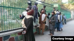 A Taliban group at Kabul Zoo during the journalist's outing with his young niece.