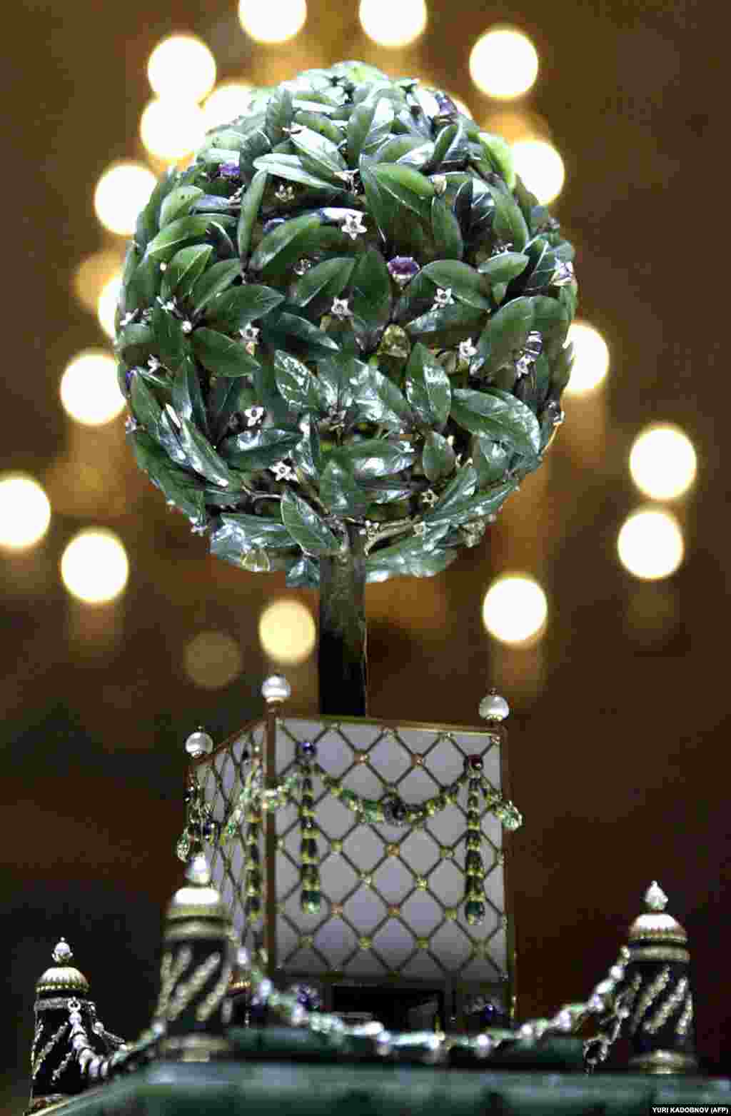 Faberge's 1911 Bay Tree Egg. One of the diamond "fruits" of the tree serves as a lever that activates a tiny jeweled bird that rises from the top of the tree, shakes its feathers, and sings. Three years after this egg was presented, an ill-prepared Russia marched to the battlefields of World War I.  