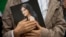 A demonstrator holds a portrait of Mahsa Amini during a rally calling for regime change in Iran following her death in September 2022.
