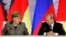 Ангела Меркель і Володимир Путін