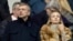 Российский миллиардер Дмитрий Рыболовлев на футбольном матче между Сент-Этьен и Монако на стадионе «Джеффрой Гишард» рядом с неизвестной женщиной, 1 марта 2014 года