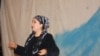 Aitadji Shabdanova, a state artist and performer with the Uzbek Music and Drama Theater in Osh, performs on stage.