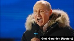 Russian President Vladimir Putin delivers a speech to his supporters on March 18.