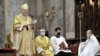 Primate of the Hungarian Catholic Church, Archbishop of Esztergom-Budapest Cardinal Peter Erdo (left) celebrates the Christmas Day mass in Esztergom, Hungary, in 2020.