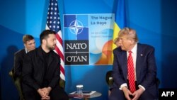 In this handout photograph taken and released by the Ukrainian Presidential Press Service on June 25, 2025, Ukraine's President Volodymyr Zelensky (L) meets with US President Donald Trump on the sideline of the North Atlantic Treaty Organization (NATO) summit in The Hague.