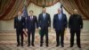US and Ukrainian negotiators pose for journalists after the conclusion of talks in Jeddah, Saudi Arabia, on March 11.