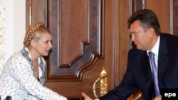 Ukrainian Prime Minister Yulia Tymoshenko (left) and former premier Viktor Yanukovych (right)