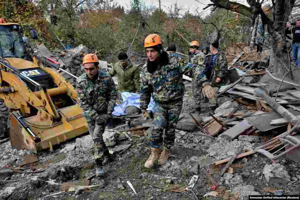 Rescuers carry the victim of a rocket attack on the city of Stepanakert on November 6. 