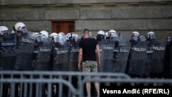 A protester remonstrates with police during violent demonstrations in Belgrade on July 8.