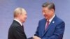 Голова Китаю Сі Цзіньпін (п) і президент Росії Володимир Путін
